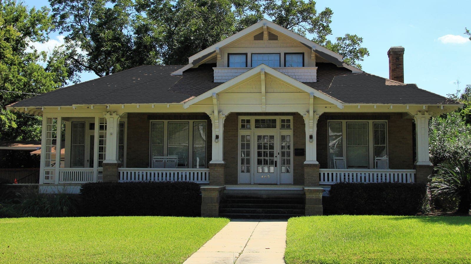 Craftsman bungalow with a brick porch and shingle roof, repainted: roof Charcoal (shingle)
