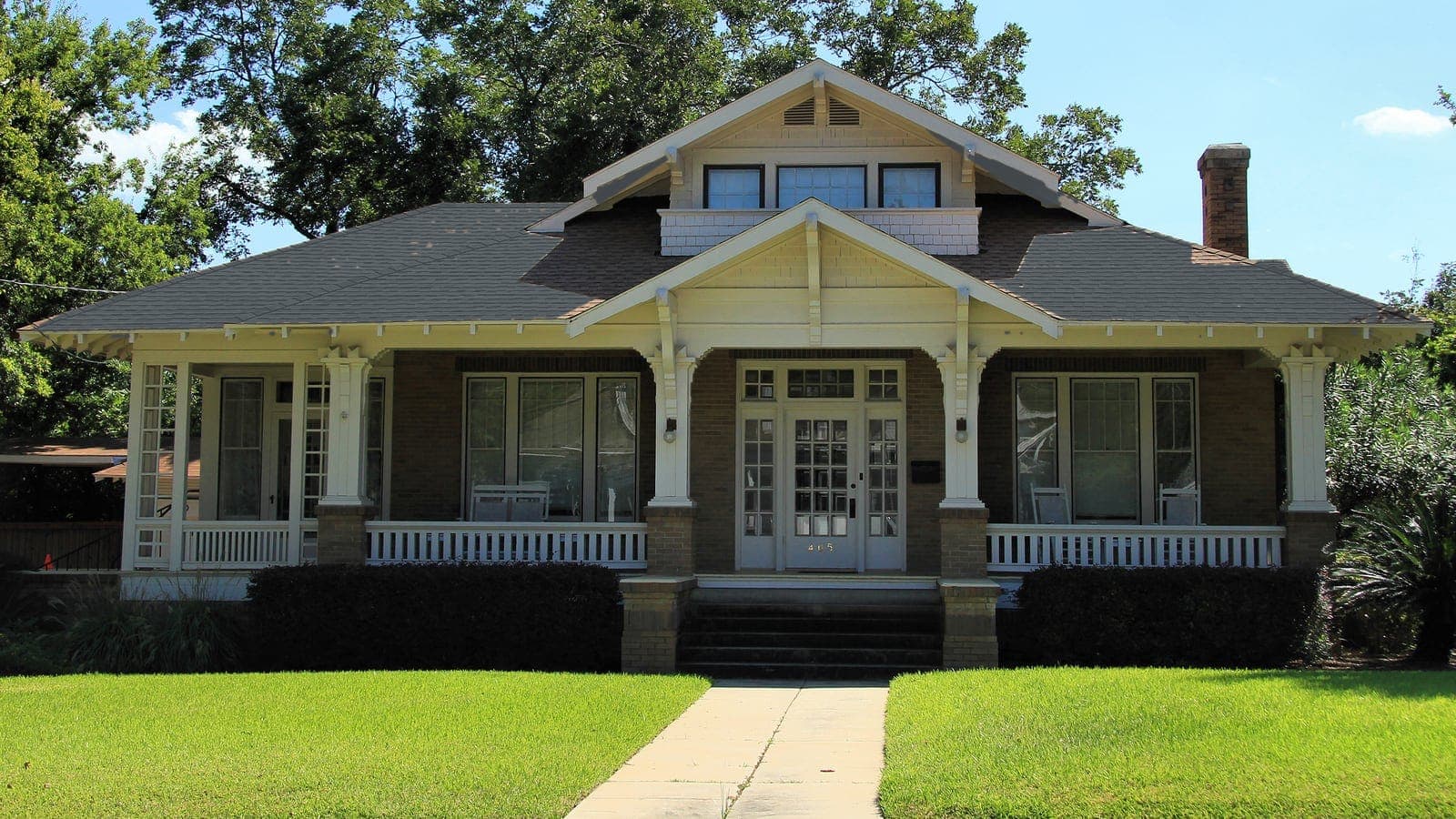 Craftsman bungalow with a brick porch and shingle roof, repainted: roof Slate Gray (shingle)
